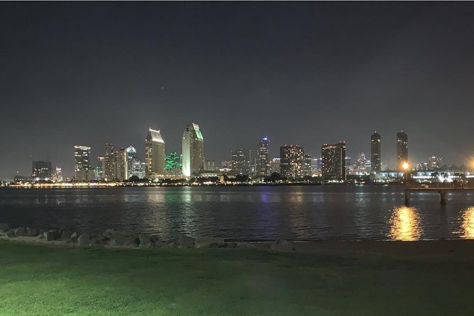 San Diego City Lights Night Tour - Embarcadero final stretch: ships, military hardware, and the harbor glow