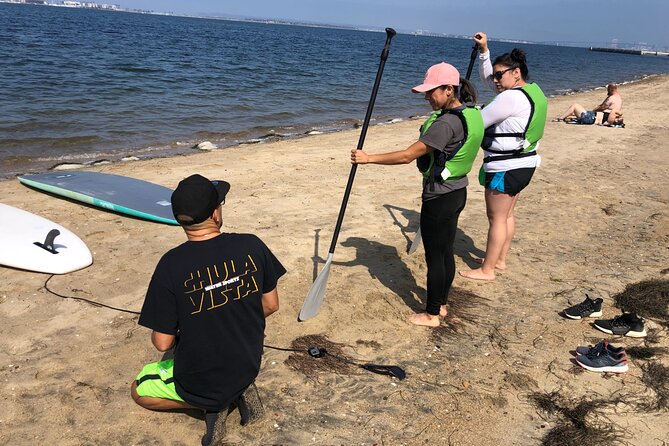 Stand up Paddle Board Lesson on The San Diego Bay - Gear and safety details: life vests, dry bag, and water shoes